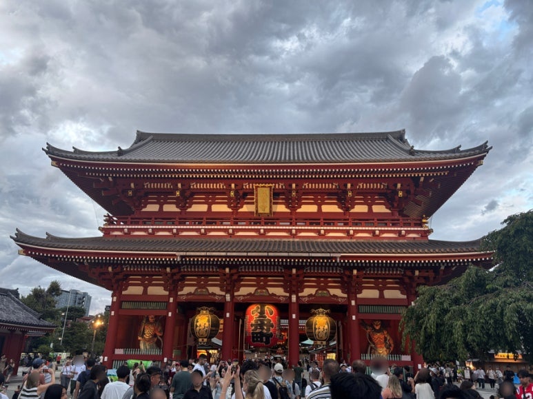 Sensoji Temple main hall with worshippers lighting incense