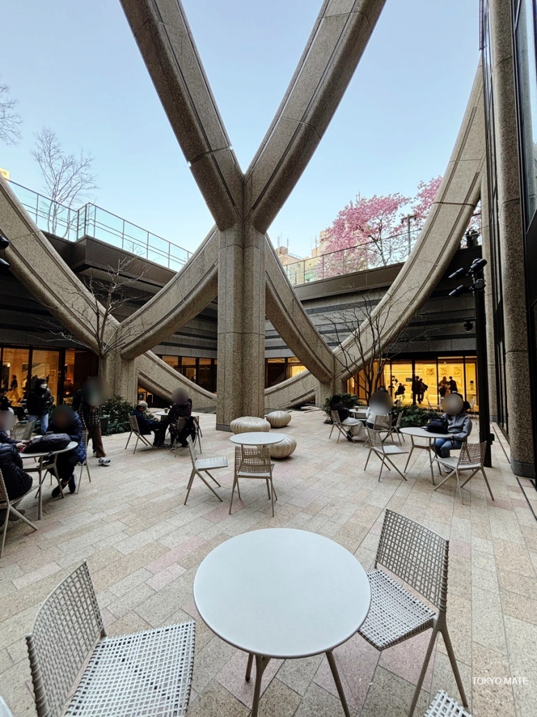 Outdoor terrace tables near %Arabica B1 at Azabudai Hills