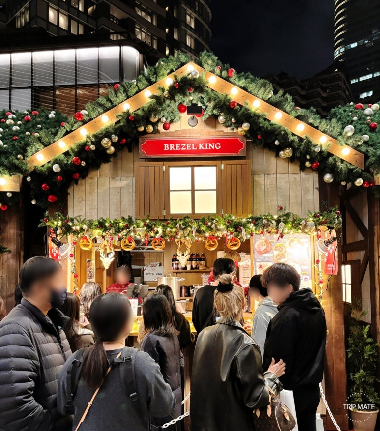 BREZEL KING booth with cheese and ham topped pretzels and dessert pretzels