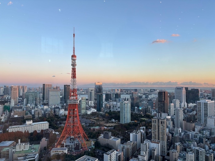 Tokyo Tower seen head-on from Azabudai Hills observatory at dusk