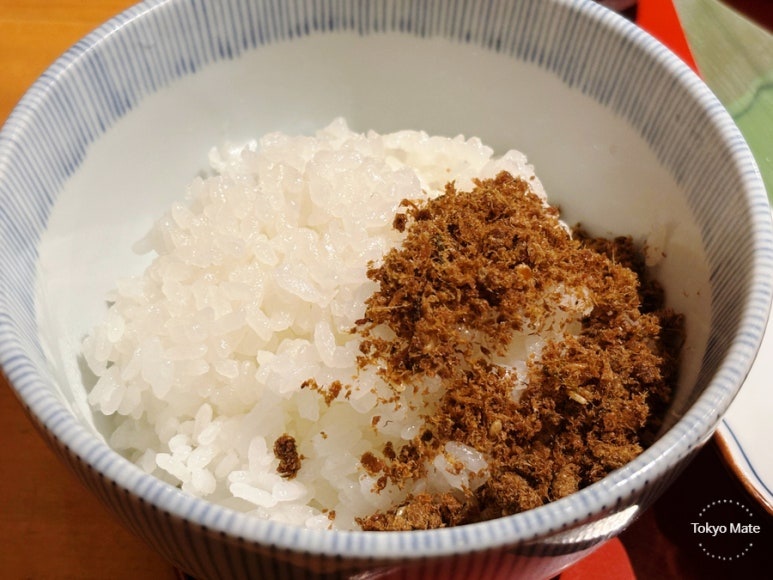Mixing furikake into rice