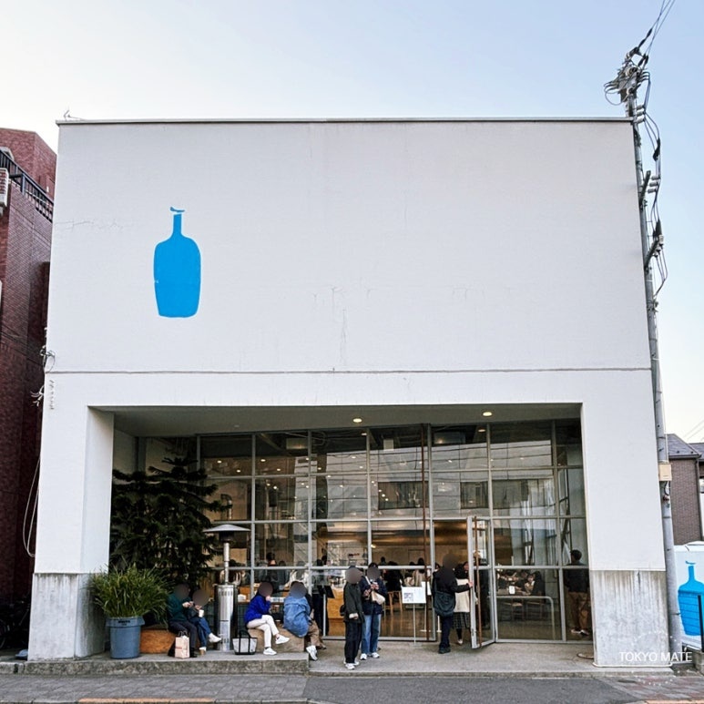 Blue Bottle Coffee Kiyosumi Shirakawa flagship cafe exterior with white-toned building