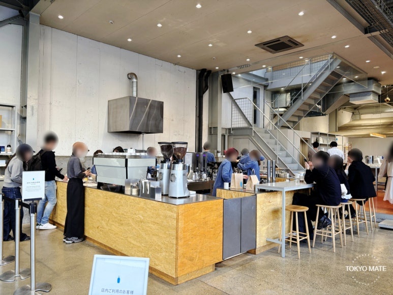 Blue Bottle Kiyosumi Shirakawa flagship cafe interior with roastery and high ceilings