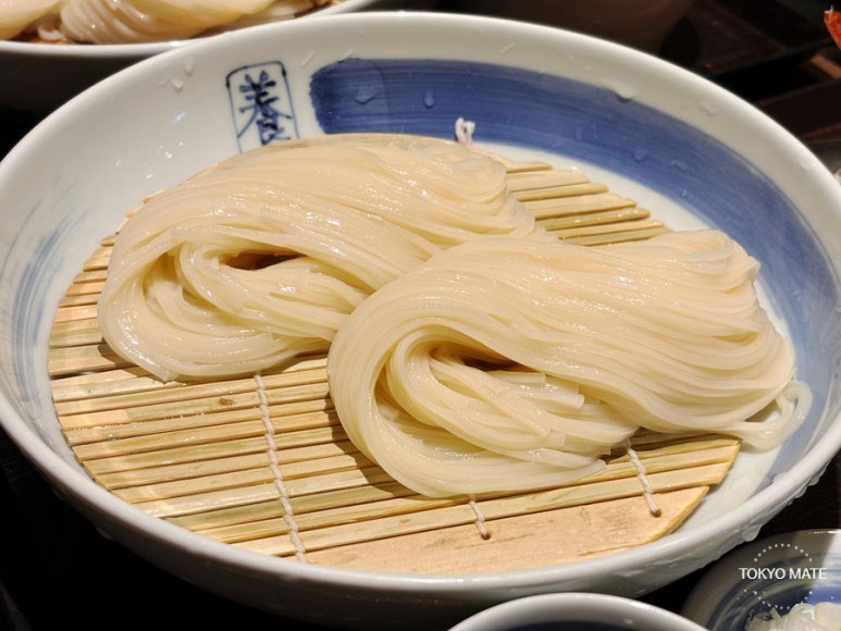 Glossy thin Inaniwa udon noodles close-up
