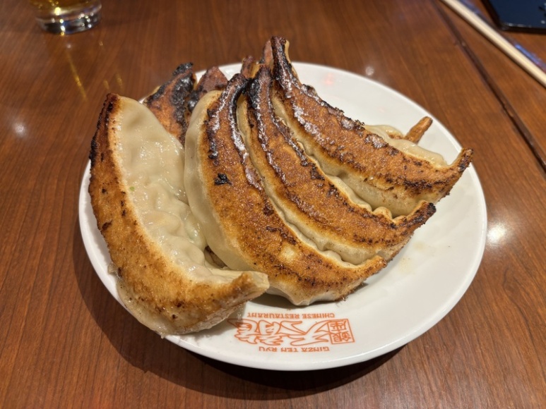 A plate of eight large grilled gyoza at Ginza Tenryu