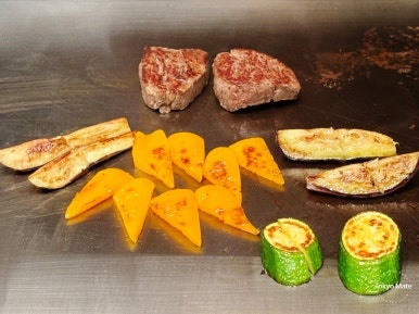 Beef steak and grilled vegetables on the iron griddle