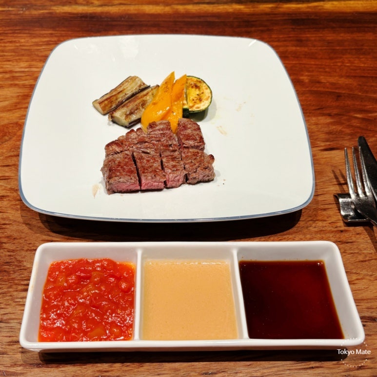 Japanese F1 beef steak with grilled vegetables, Tokyo hotel teppanyaki main course