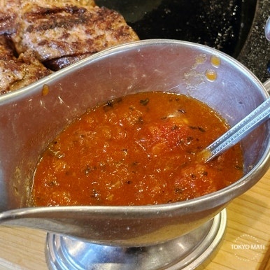 Grill K Queen hamburg steak with tomato basil close-up