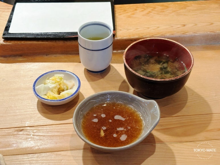 Tensuke tamago lunch set with miso soup, tempura sauce, pickles, and green tea