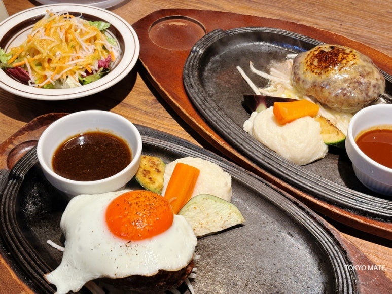 Comparing the demiglace cheese hamburg and the fried egg hamburg at Meat Yazawa