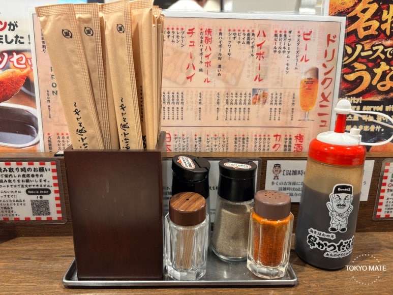 The pump sauce bottle on the table at Kushikatsu Daruma Namba