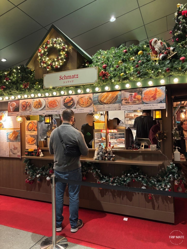 Schmatz booth serving German craft beer and Christmas cuisine
