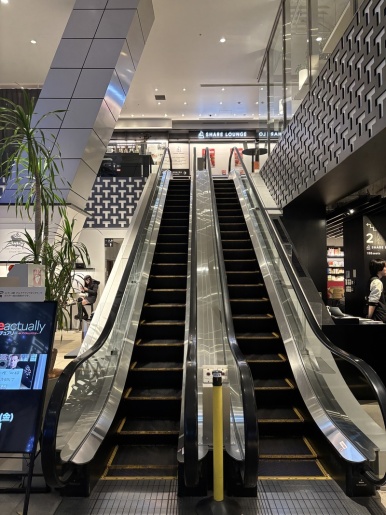 Escalator up to the Share Lounge