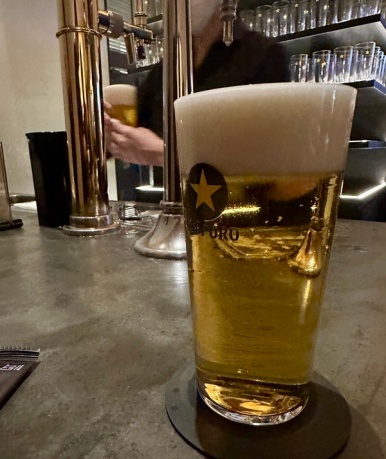 A glass of Perfect Black Label draft beer at the Sapporo The Bar counter