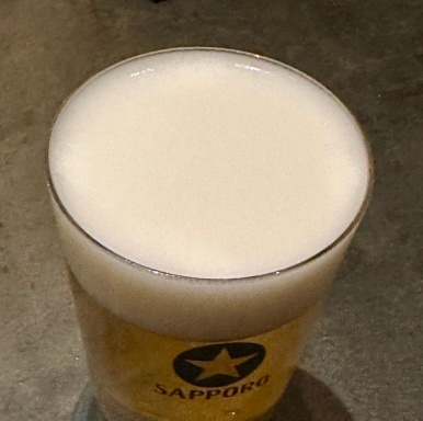 Close-up of the fine creamy head on a Perfect Black Label beer