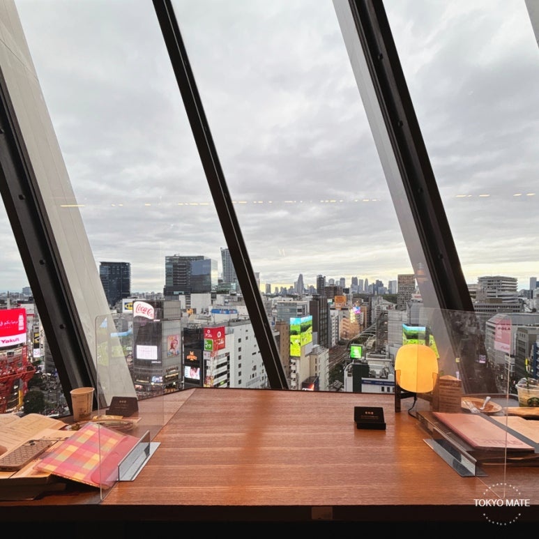 Window seat and the view over central Shibuya at the 11th-floor Tsutaya Share Lounge in Shibuya Scramble Square