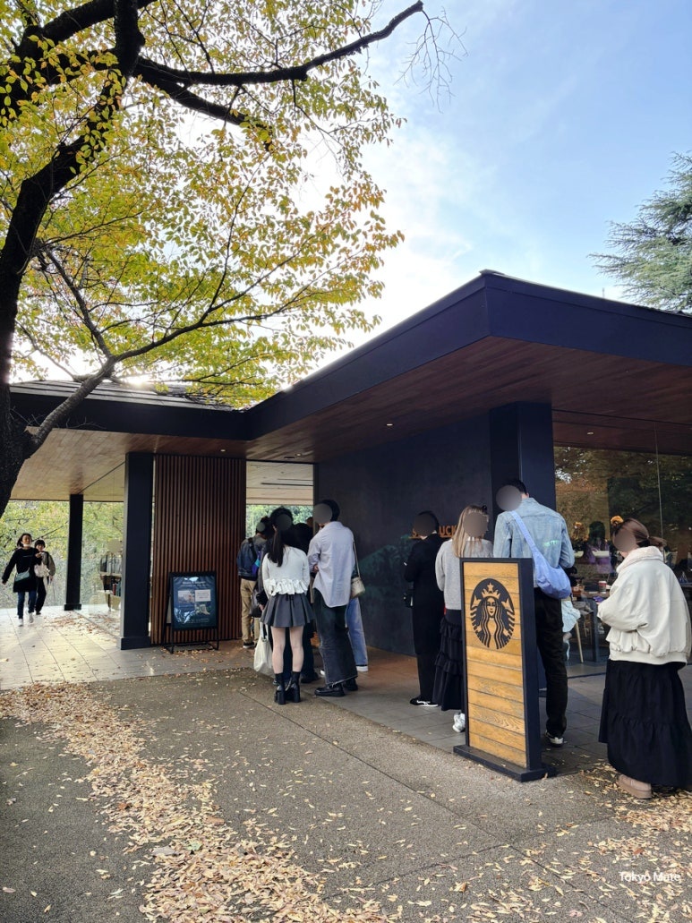 Long queue at Starbucks Shinjuku Gyoen during cherry blossom season