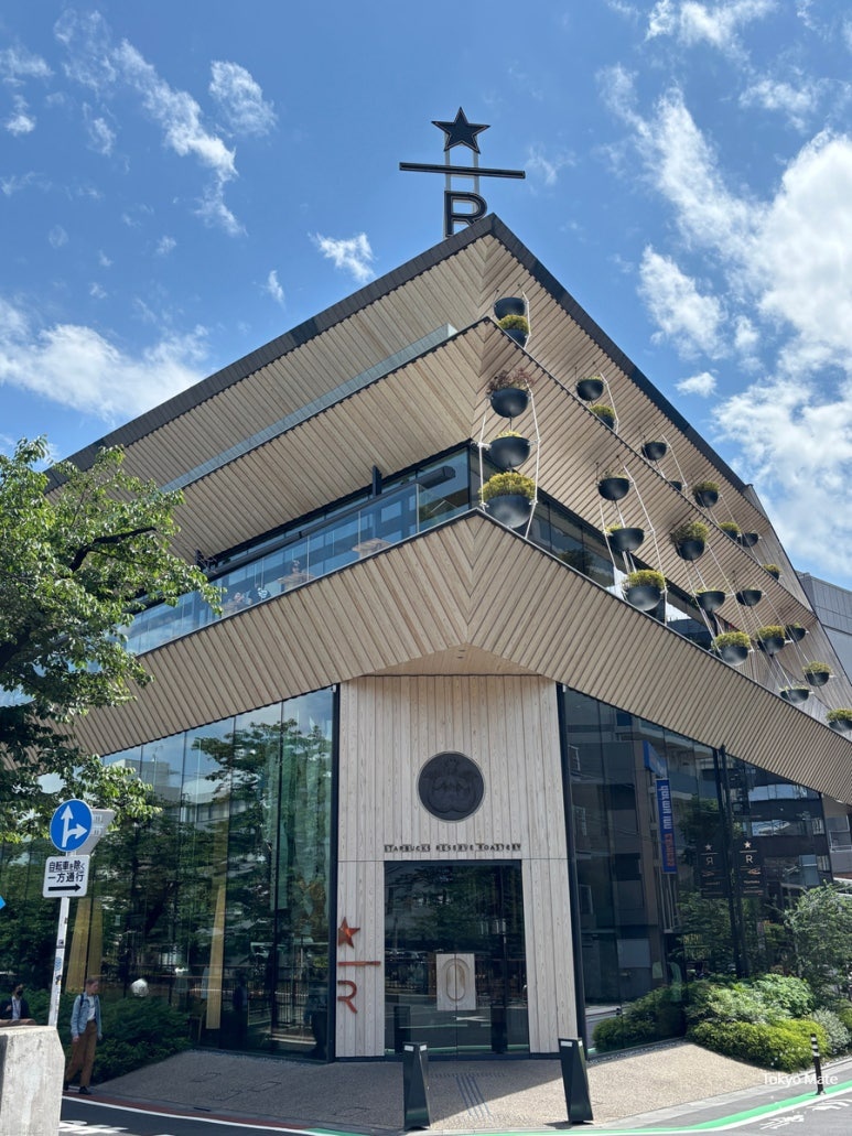 Exterior of Starbucks Reserve Roastery Tokyo showcasing Kengo Kuma's architectural aesthetics