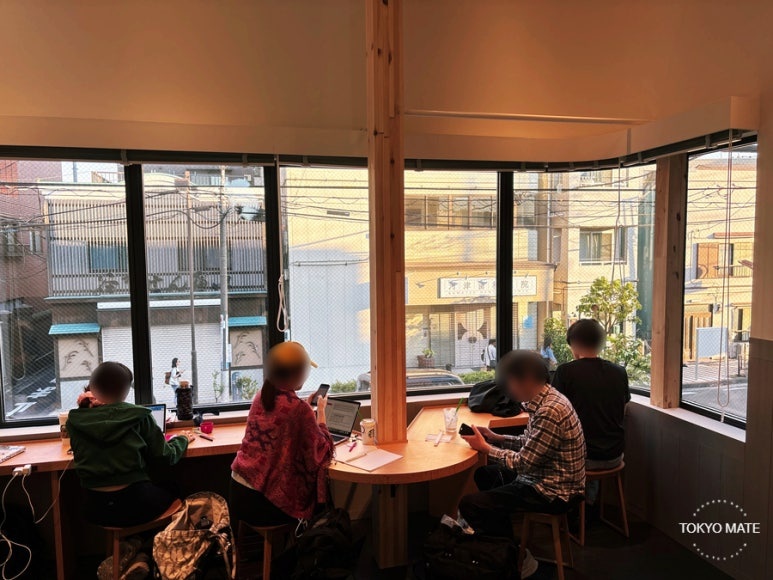 Window-side counter seats on the 2nd floor overlooking Yanaka street
