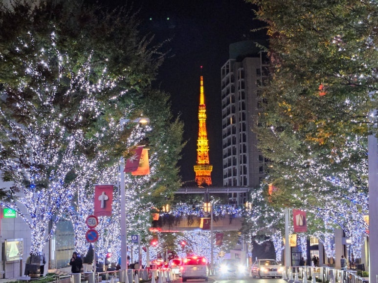 Blue illumination on Roppongi Hills Keyakizaka street with Tokyo Tower in the distance