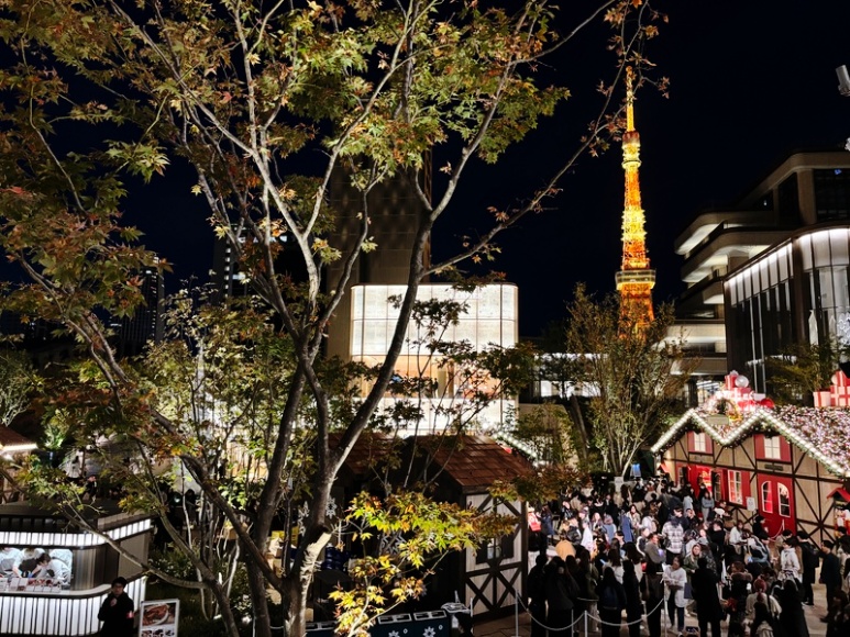 Tokyo Tower night view shining beyond Azabudai Hills Christmas Market