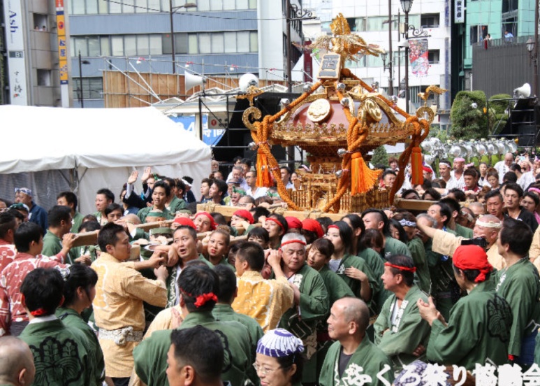 Multiple massive mikoshi filling the streets of Ikebukuro