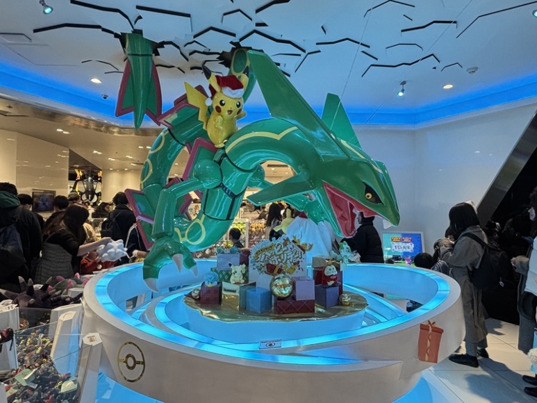 Rayquaza and Santa hat Pikachu at the store entrance