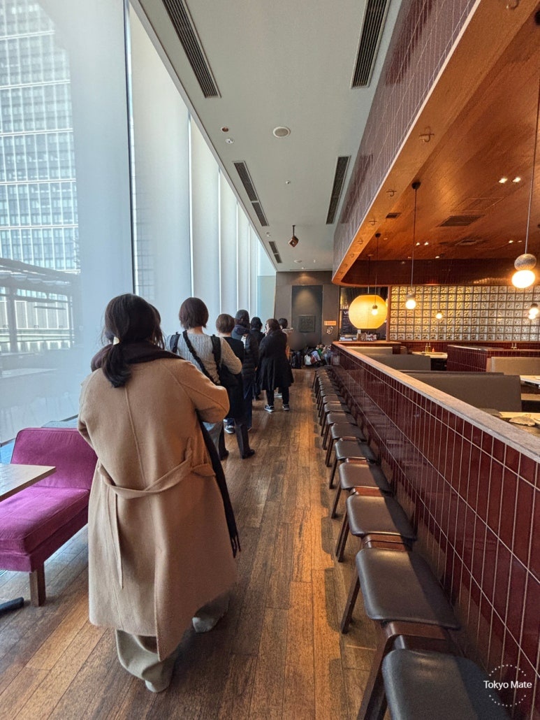 People Waiting in Line at Sawamura Marunouchi