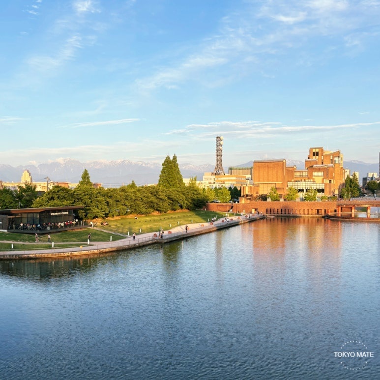 View of Kansui Park's Tenmonkyo Bridge and the Toyama Station area