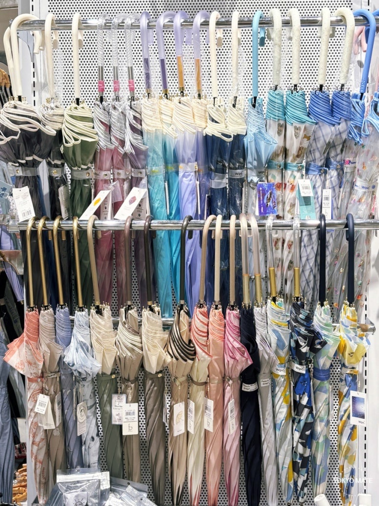 Wpc. long umbrellas and folding umbrellas displayed at Ginza Loft