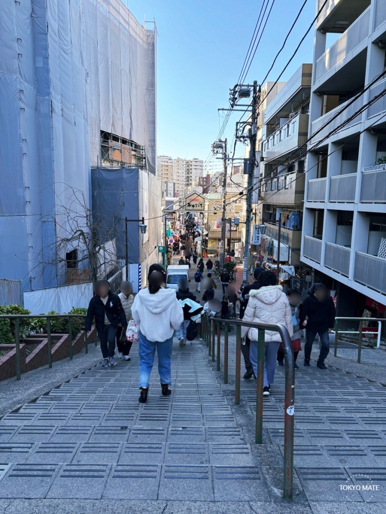 Yuyake Dandan under large building construction