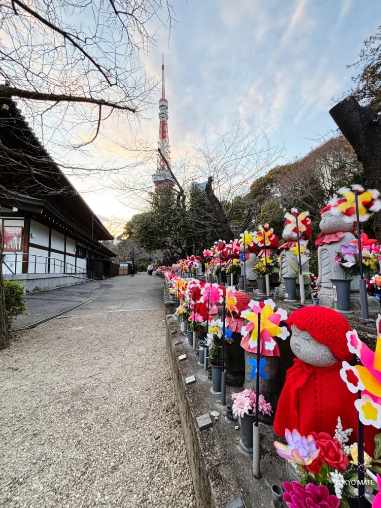 Tokyo Zojoji Jizo statues with Tokyo Tower scenery